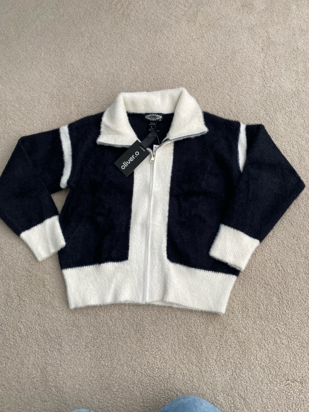 New. Oliver. O, Black and White Fuzzy Zip-Up cardigan in size medium.